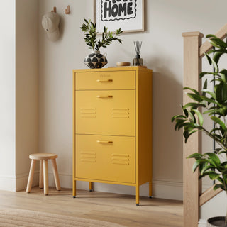 The Shoreditch shoe cabinet in mustard with a top drawer, two lower shoe compartments and matching handles, styled in a hallway.