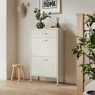 The Shoreditch shoe cabinet in Vanilla with a top drawer, two lower shoe compartments and matching handles, styled in a hallway.