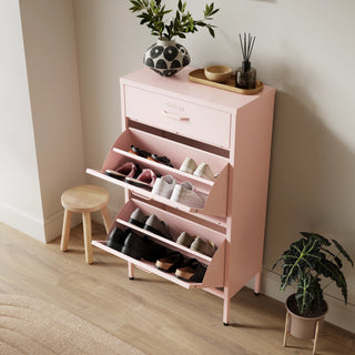 The Shoreditch shoe cabinet in pink with a top drawer, two lower shoe compartments and matching handles, styled in a hallway.