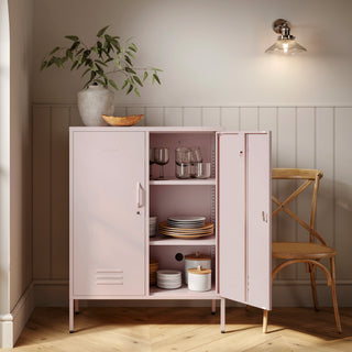 The Fulham metal storage locker in light pink with 2 doors, one open showing tableware inside 