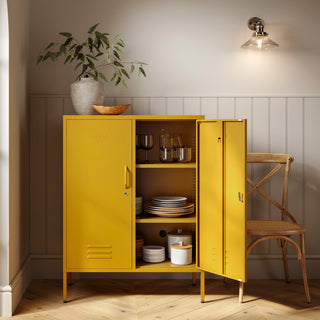 The Fulham metal storage locker in mustard yellow with 2 doors, one open showing tableware inside 