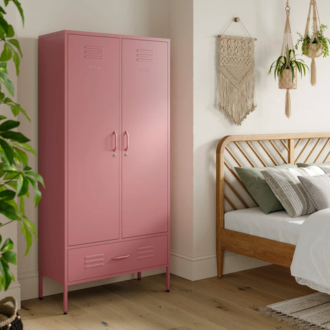 Metal, tall, double-door and single-drawer storage locker in flamingo pink, in a bedroom