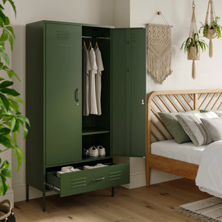 Metal, tall, double-door and single-drawer storage locker in forest green, open showing clothes and shoes, in a bedroom