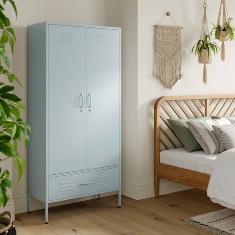 Metal, tall, double-door and single-drawer storage locker in sky blue, in a bedroom