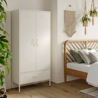 Metal, tall, double-door and single-drawer storage locker in vanilla, in a bedroom