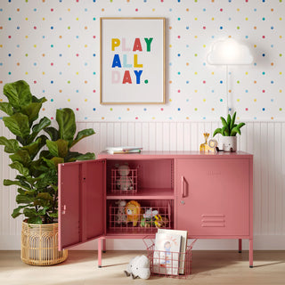 The Oxford metal storage locker in flamingo pink with two doors, one open showing baskets of toys inside 