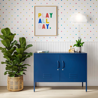 The Oxford metal storage locker in navy blue with two doors, with books and toys on top