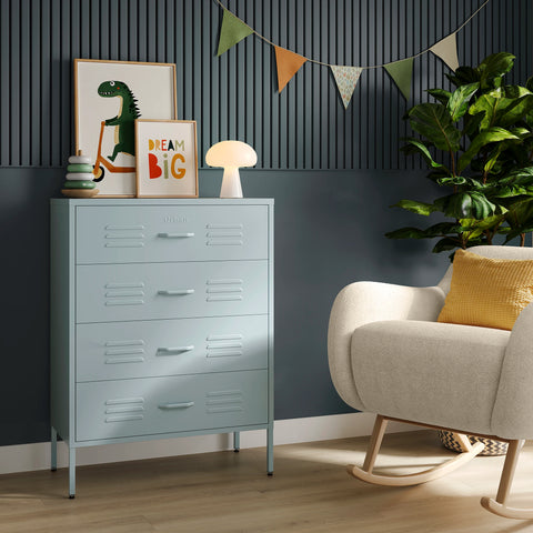 The Harrow sky blue metal drawers with 4 drawers, in a room next to a chair