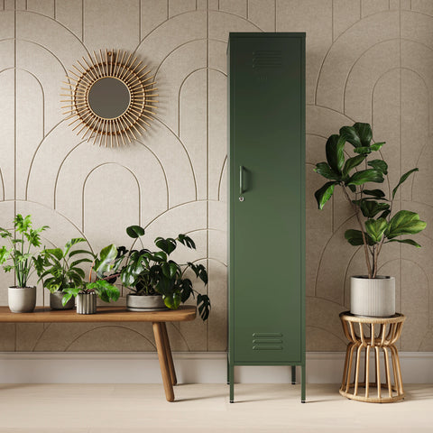 The Bexley single-door tall storage locker in forest green, next to some plants