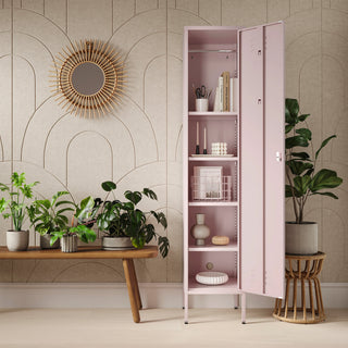 The Bexley single-door tall storage locker in light pink, with the door open showing accessories and stationary