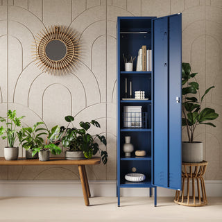 The Bexley single-door tall storage locker in navy blue, with the door open showing accessories and stationary