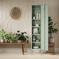 The Bexley single-door tall storage locker in sage green, with the door open showing accessories and stationary