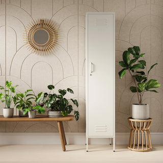 The Bexley single-door tall storage locker in vanilla, next to some plants