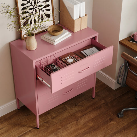 The Lambeth metal storage drawers in flamingo pink, with one draw open showing a basket and books 