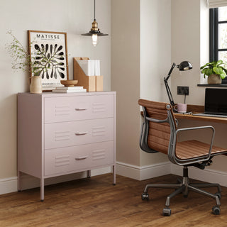 The Lambeth metal drawers in light pink, in a room next to a desk