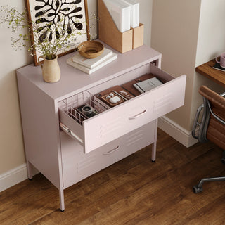 The Lambeth metal storage drawers in light pink, with one draw open showing a basket and books 