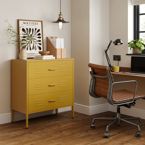 The Lambeth metal drawers in mustard yellow, in a room next to a desk