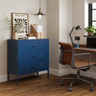 The Lambeth metal drawers in navy blue, in a room next to a desk