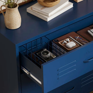 The Lambeth metal storage drawers in navy blue, with one draw open showing a basket and books 