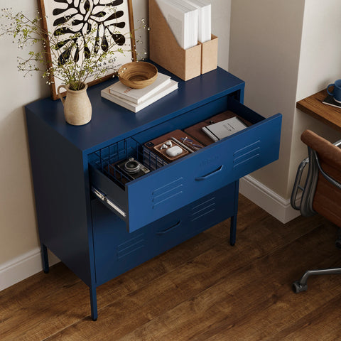 The Lambeth metal storage drawers in navy blue, with one draw open showing a basket and books 