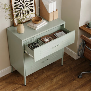 The Lambeth metal storage drawers in sage green, with one draw open showing a basket and books 