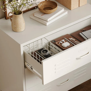 The Lambeth metal storage drawers in vanilla, with one draw open showing a basket and books 