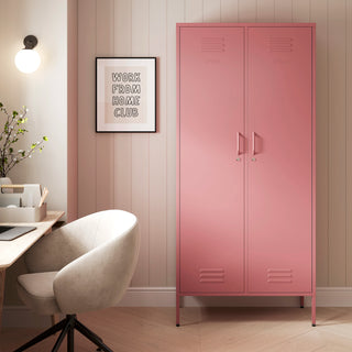 The Chelsea tall double-door metal storage locker in flamingo pink in a room