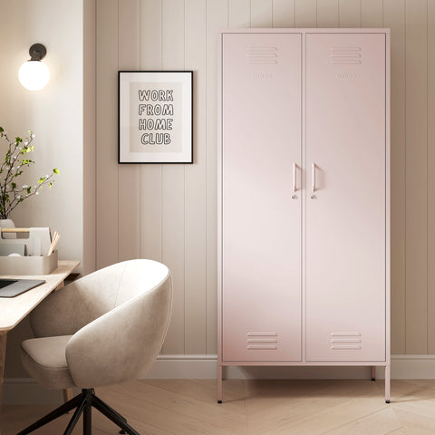 The Chelsea tall double-door metal storage locker in light pink in a room