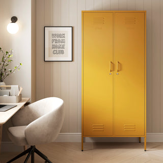 The Chelsea tall double-door metal storage locker in mustard yellow in a room