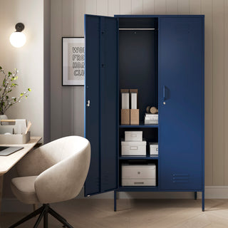 The Chelsea tall double-door metal storage locker in navy blue with one door open, in a room