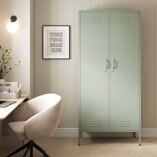 The Chelsea tall double-door metal storage locker in sage green in a room