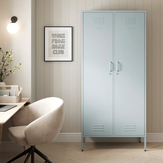 The Chelsea tall double-door metal storage locker in sky blue in a room