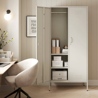 The Chelsea tall double-door metal storage locker in vanilla with one door open in a room