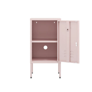 The Camden metal bedside table storage locker in light pink, with the door open