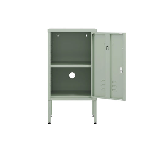 The Camden metal bedside table storage locker in sage green, with the door  open